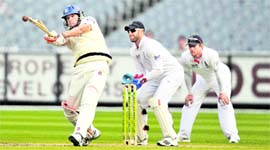England's wicketkeeper Matt Prior looks on as Victoria's Clint McKay hits a six to bring up 50 runs during the second day of their Ashes cricket tour match against Victoria in Melbourne on Saturday.