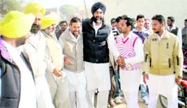 People welcome Manpreet Singh Badal in Bhagi Vandar village in Bathinda district on Tuesday.
