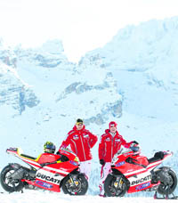 Ducati Moto GP rider Valentino Rossi (L) and his teammate Nicky Hayden (R) pose with their bike Ducati GP2011 during the "Wrooom, F1 and MotoGP Press Ski Meeting", Ducati and Ferrari's annual media gathering, in Madonna di Campiglio on Wednesday.