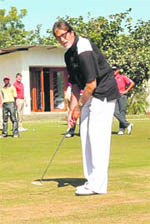 Bollywood actor and Gujarat Tourism brand ambassador Amitabh Bachan putting on the green at the Kensville Golf and Country Club near Ahmedabad on Wednesday