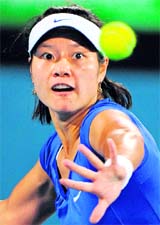 China's Li Na watches the ball during her match against Kim Clijsters of Belgium in the Sydney International women's tennis final on Friday.