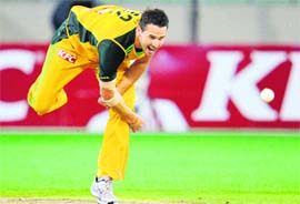 Australian pace bowler Shaun Tait in action in the T20 match against England at the MCG in Melbourne on Friday.