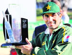 Pakistan captain Misbah-ul-haq holds the trophy after winning the series against New Zealand after drawing the second Test in Wellington on Wednesday