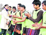Asian Games gold medallist Manjeet Kaur meets hockey players during the 7th All-India Balwant Singh hockey tournament in Jalandhar on Thursday.