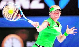 Kim Clijsters of Belgium returns to Alize Cornet of France during their match at the Australian Open tennis tournament in Melbourne on Saturday.