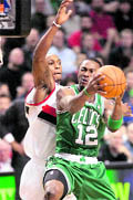 Boston Celtics guard Von Wafer (R) shoots as Portland Trail Blazers forward Dante Cunningham defends during their match in Oregon on Thursday