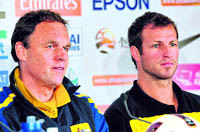 Australia's coach Holger Osieck (L) and defender Lucas Neill at a press conference on Friday