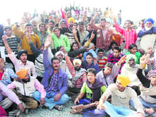Unemployed villagers raise slogans for not getting jobs at the thermal plant set-up near Nalas village on Monday. 