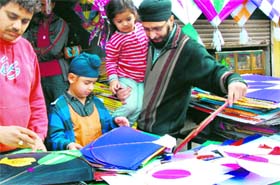 A boy selects kites ahead of Basant Panchmi at a shop in Bathinda on Sunday.
