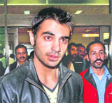 Salman Butt arrived from Doha at the Allama Iqbal International airport in Lahore on Sunday. Butt said he is "disappointed" by a 10-year ban imposed on him by an anti-corruption tribunal and will seek a reduced penalty. 