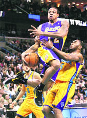 Los Angeles Lakers guard Shannon Brown (12) is fouled by New Orleans Hornets guard Marcus Thornton (5) during the NBA game in New Orleans on Sunday.