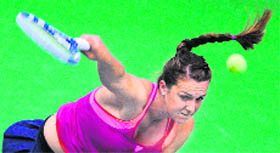 Russian Anastasia Pavlyuchenkova returns to French Alize Cornet during their Fed Cup match in Moscow on Sunday