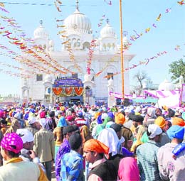 Devotees gather to pay obeisance at Gurdwara Chheharta Sahib, near Amritsar, on the occasion of Basant Panchami on Tuesday.