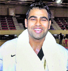 Sandeep Kundu gestures after winning title for Taekwondo, first Gold Medal during the 34th National Games in Ranchi, Jharkhand on Sunday