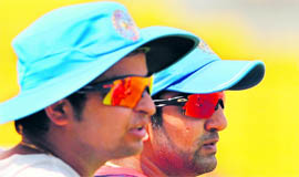 Suresh Raina (L) and Gautam Gambhir during a training session in Chennai on Tuesday.