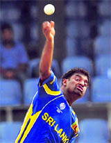 Muttiah Muralitharan bowls during the ICC World Cup warm-up match against West Indies at the R. Peremadasa Stadium in Colombo on Tuesday.