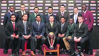 The 14 national captains, ( front row L-R) Canada's Ashish Bagai, Netherlands� Peter Borren, Sri Lanka�s Kumar Sangakkara, Australia's Ricky Ponting, Bangladesh's Shakib Al Hasan, Kenya's Jimmy Kamande and Ireland�s William Porterfield, (Back Row L-R) Zimbabwe's Elton Chigumbura, New Zealand's Daniel Vettori, Pakistan�s Shahid Afridi, India's Mahendra Singh Dhoni, South Africa's Graeme Smith, England's Andrew Strauss and West Indies� Darren Sammy pose with the ICC Cricket World Cup trophy in Dhaka
