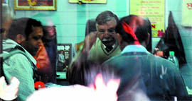 Officials of the income tax department examining the documents at a business establishment of area in-charge of the SAD for Bathinda (Urban) Assembly constituency Sarup Chand Singla during a raid in Bathinda on Friday.