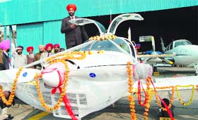 KS Pannu, Deputy Commisioner, Amritsar, stands atop a Hansa-3 aircraft at the Amritsar International Airport, Rajasansi