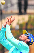 Tillakaratne Dilshan catches a ball during a training session in Hambantota