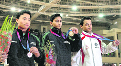 Gold medallist Ashish Kumar of Uttar Pradesh (C) , Silver medallist Rakesh of Services (L) and Bronze medallist Aditya Narayan Singh of Uttar Pradesh after their win in Men's Artistic Gymnastic during the 34th National Games in Ranchi