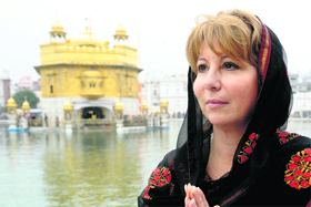 Mayor of the Canadian city of Surrey Dianne L. Watts pays obeisance at the Golden Temple on Sunday.