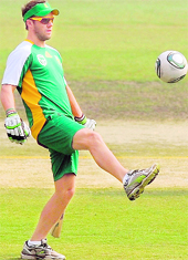 A B de Villiers plays with a football during a training session at the Ferozshah Kotla stadium in New Delhi on Wednesday