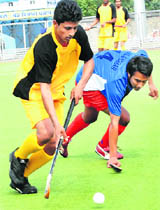 A hockey match in progress during the Punjab Games at the Olympian Surjit Hockey Stadium, Jalandhar on Tuesday.