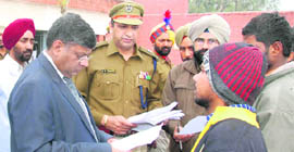 Justice MM Kumar of the Punjab and Haryana High Court hears the grievances of an inmate during an inspection of the Ludhiana Central Jail on Friday.