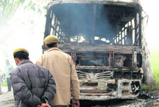 One of the buses torched by a mob in Dalam village (Amritsar) on Friday.