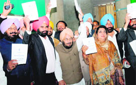 Congress legislators stage a walkout during the Governor�s Address in the Vidhan Sabha in Chandigarh on Friday.
