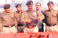 Officials of the BSF with the arms and ammunition seized in the New Gajniwala BOP area in the Ferozepur sector on Saturday. A Tribune photograph