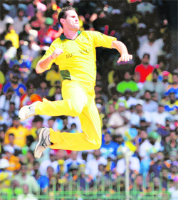 Shaun Tait celebrates the wicket of Tillakaratne Dilshan in Colombo on Saturday. Sri Lanka were 146 for 3 in 32.5 overs before rain stopped play. 