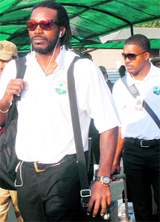 West Indies cricketers Chris Gayle (L) and Darren Bravo arrive at the Chandigarh airport on Saturday.