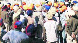 Activists of radical Sikh organisations argue with policemen during a protest on the Ferozepur-Moga road on Sunday.