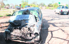 The mangled remains of a car that met with an accident with a truck on the Khanpur-Kharar road on Saturday.