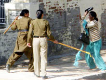 Women constables beating up an agitator.