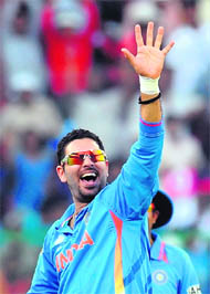 Yuvraj Singh celebrates after taking his fifth wicket of Ireland's Alexander Cusack during the match between India and Ireland at the M Chinnaswamy Stadium in Bangalore on Sunday. Yuvraj also scored an unbeaten half-century as India defeated Ireland by five wickets