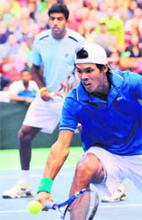 Rohan Bopanna and Somdev Devvarman (R) of India during their Davis Cup World Group first round doubles match in Serbia
