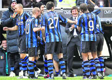 Inter Milan's Brasilian coach Leonardo (C) celebrates with his players after their win over Genoa in the Serie A match in Milan's San Siro Stadium on Sunday .