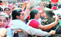 Anganwadi workers from Punjab stage a protest in Sector 22,Chandigarh, on Tuesday.