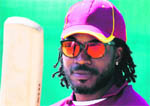 West Indies� Chris Gayle looks at his bat during a practice session ahead of their World Cup match against Ireland in Mohali on Thursday. 