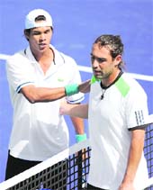 Somdev Devvarman (L) shakes hands with Marcos Baghdatis after beating him in straight sets during the BNP Paribas Open in Indian Wells, California on Saturday. Somdev won 7-5, 6-0.