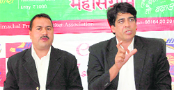 Col. Arvinder (R), chief operating officer of King�s XI Punjab team, addressing a press conference at HPCA stadium in Dharamshala on Monday.