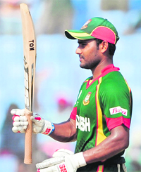 Bangladesh's Imrul Kayes raises his bat after reaching his half century during their Group B match against Netherlands in Chittagong on Monday. Kayes scored 73.