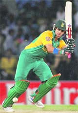JP Duminy keeps his eyes on the ball after playing a shot against Ireland in Kolkata on Tuesday.
