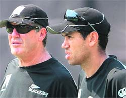 New Zealand coach John Wright (L) speaks with Ross Taylor during a training session at The Wankhede stadium in Mumbai on Thursday. 