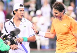 Rafael Nadal (R) consoles Somdev Devvarman after defeating him at the Indian Wells tennis tournament on Wednesday. Nadal beat Somdev 5-7, 4-6. 
