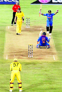 Suresh Raina (R) and Yuvraj Singh celebrate after hitting the winning runs as India defeated Australia in