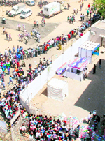 Spectators queue outside the stadium before the start of the India-Australia match on Thursday